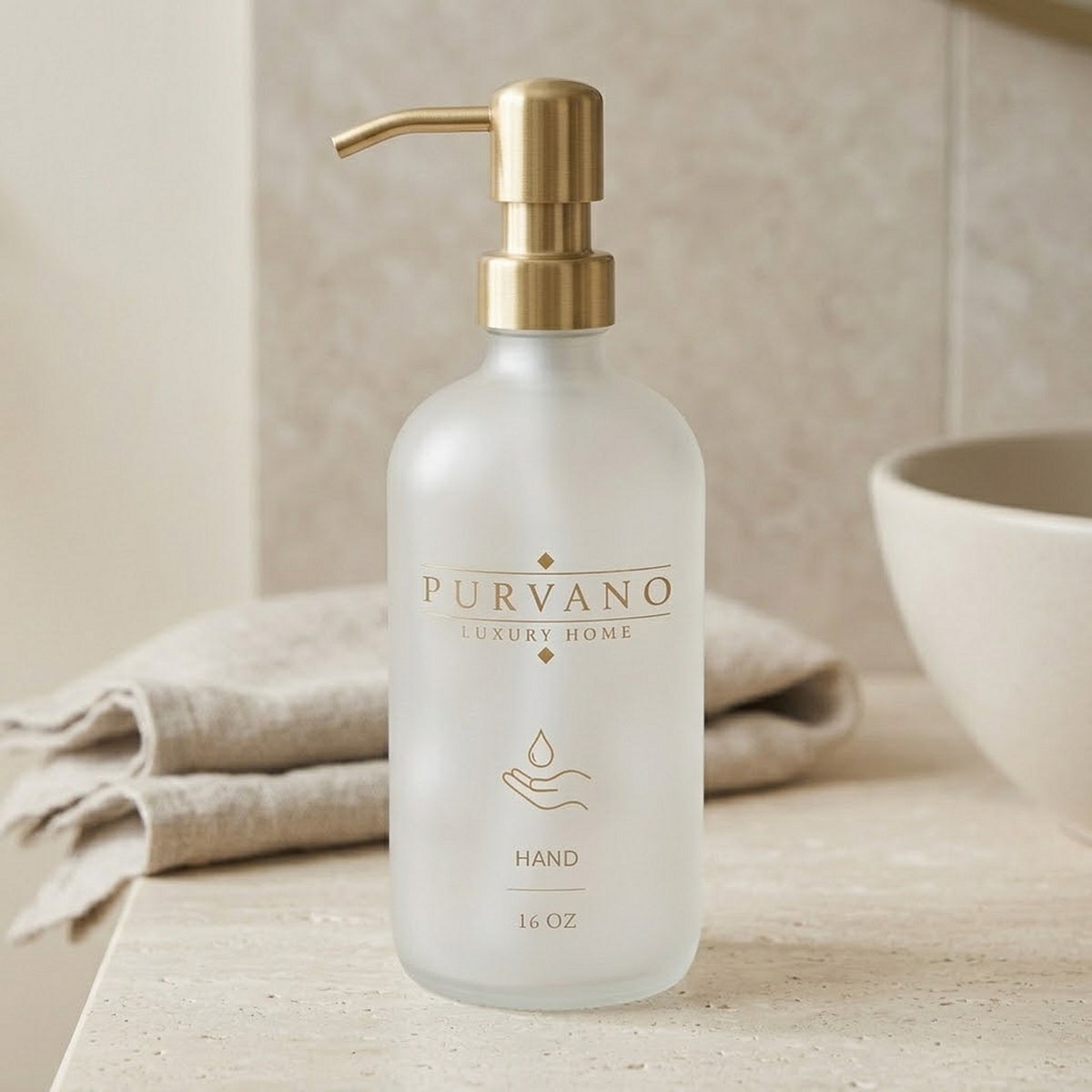 PURVANO frosted HAND soap dispenser on a stone kitchen counter beside folded linen in soft daylight