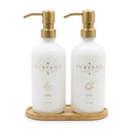 PURVANO matte white glass hand and dish soap dispenser set with brushed gold pumps on a bamboo tray