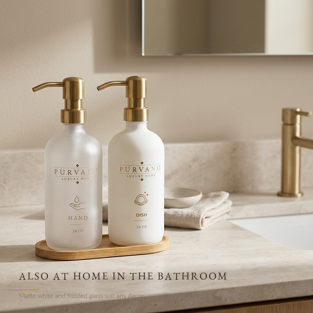 Hand using the gold pump on a frosted and white glass soap dispenser set at a kitchen sink